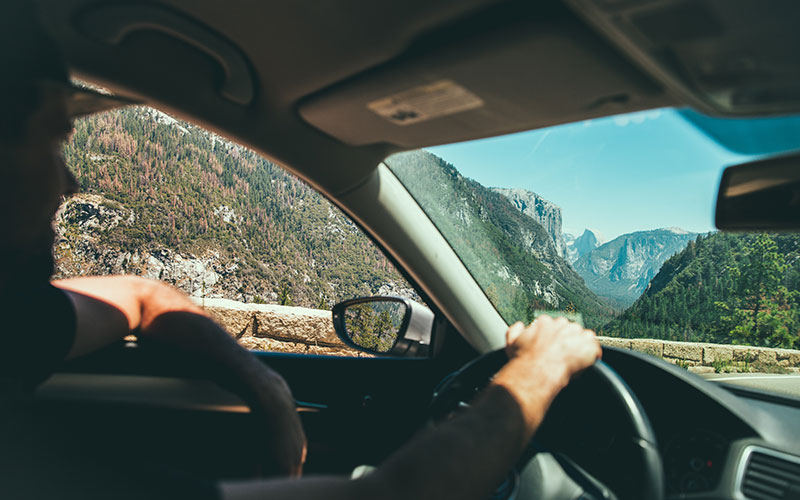 Man driving through the mountains