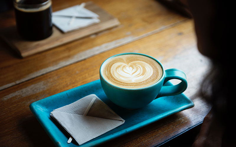 Cup of coffee in a blue coffee cup