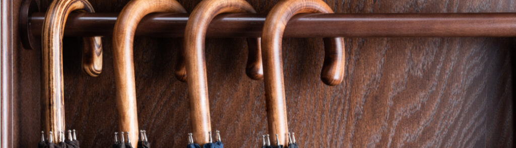 Classic wooden handle umbrellas hanging up
