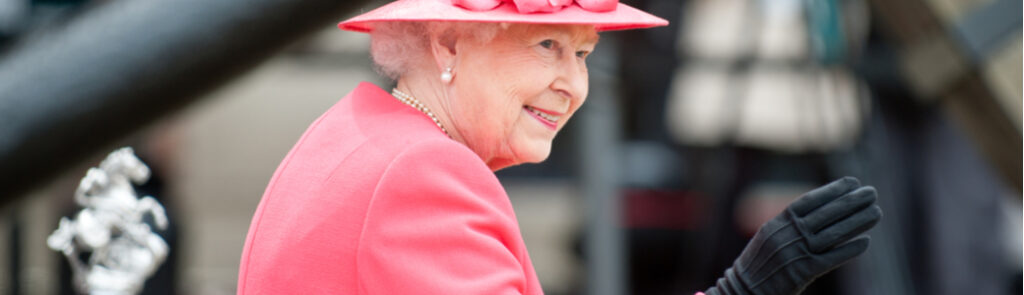 Queen Elizabeth II waving in Liverpool.