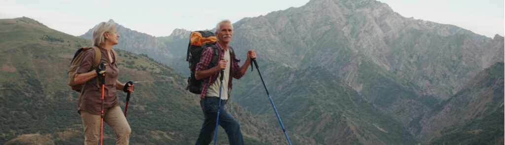 A retired couple hiking.