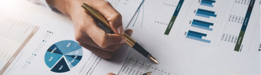 Two people looking at financial documents.