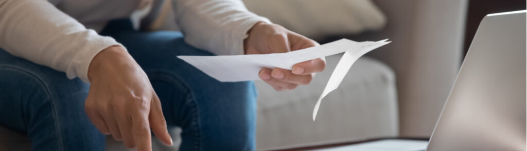 A person looking through paperwork.