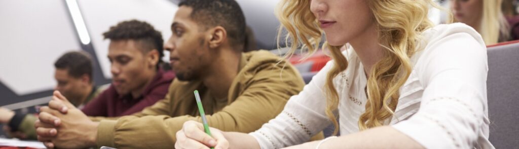 A group of students in a university lecture hall.
