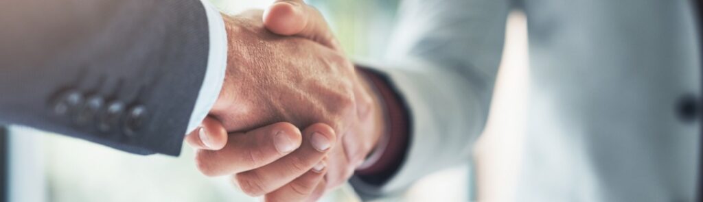 Two people shaking hands.