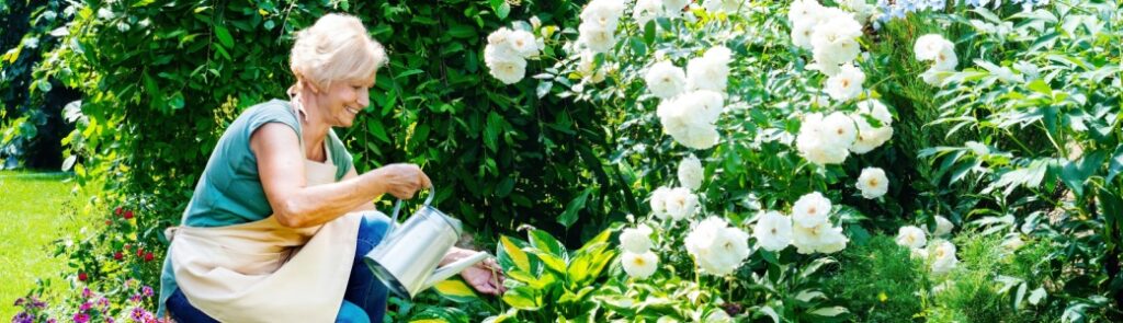 A woman tending to a garden.