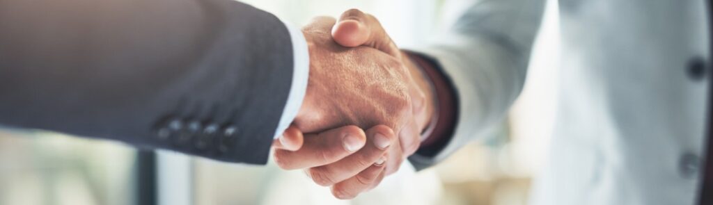 Two people shaking hands.
