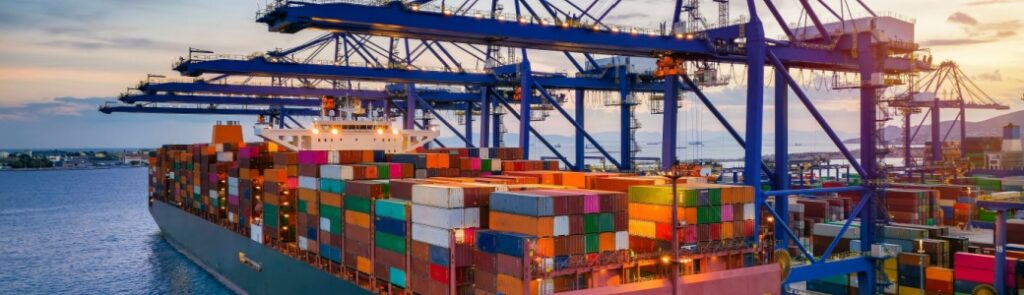 A container cargo ship at a commercial dock.