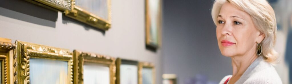 A woman looking at art in a gallery.