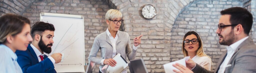 A group of colleagues sitting around a conference table.