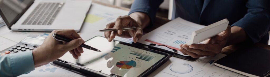 Business people looking at documents in an office.