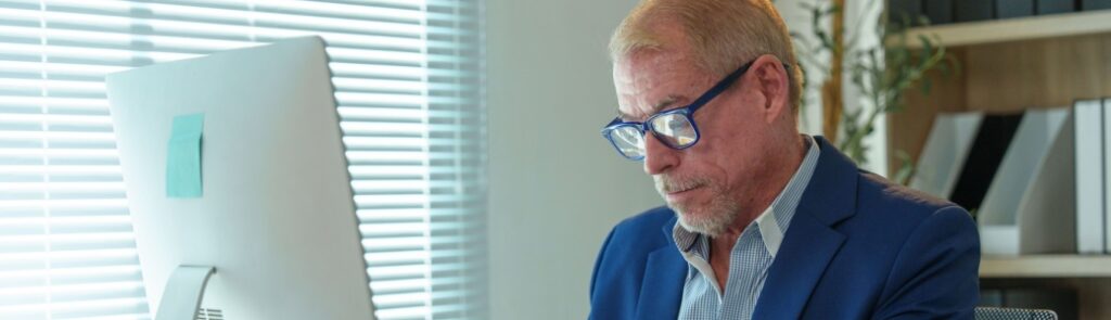 A man working at an office desk.