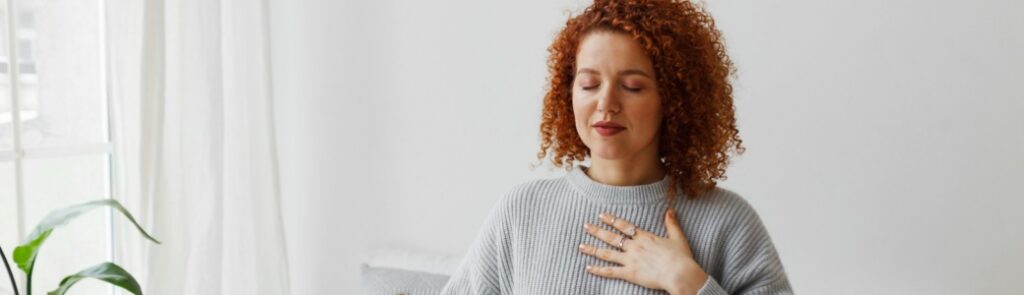 A lady focusing on her breathing.