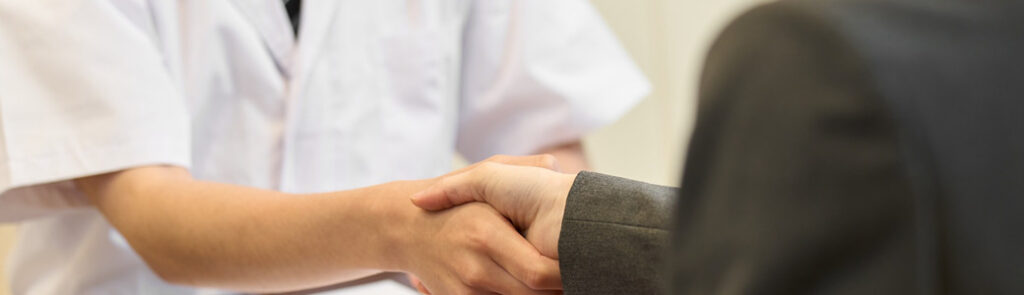 Two people shaking hands.